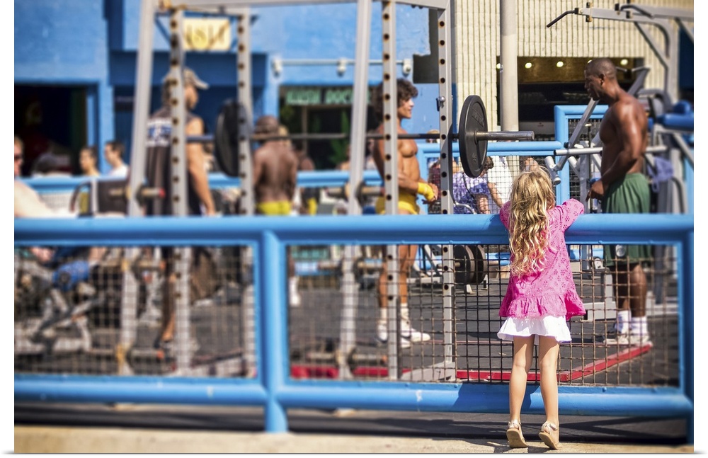 Curiosity, Muscle Beach, young girl watching muscle men, color photograph