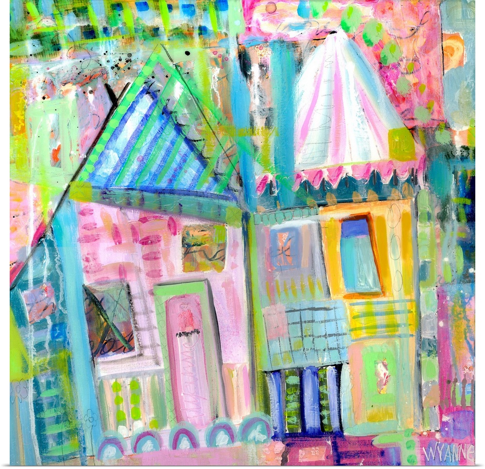 Two pastel colored houses in shades of green, pink, and blue.