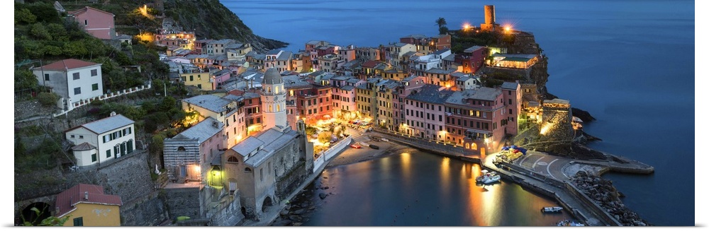A photograph of an Italian coastal village atop a cliff.