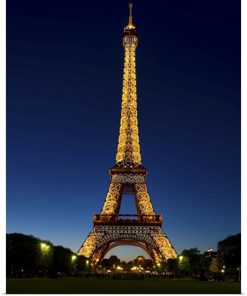 A photograph of the Eiffel Tower seen at night.