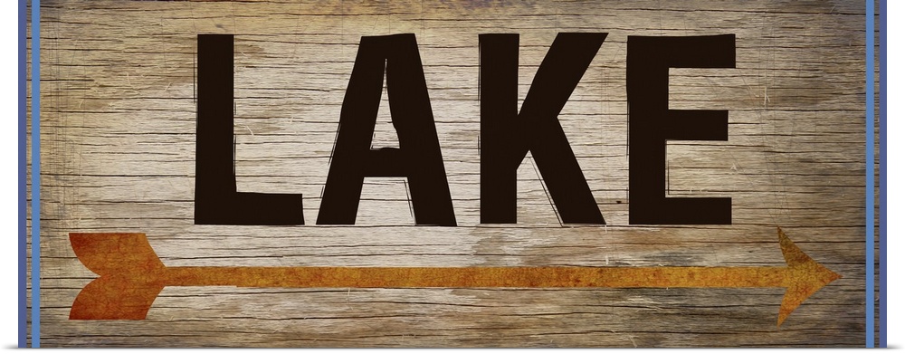 Wooden sign with an orange arrow, 2 blue lines on each side, and the word "Lake" written across it.
