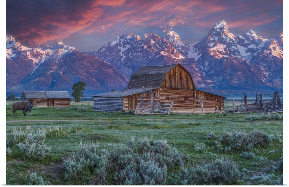 A photograph of the Mormon Row Barn in Wyoming, with the Teton mountains in the background.