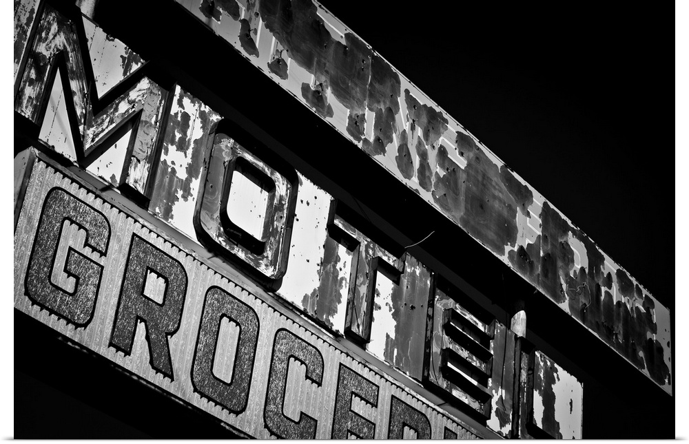 Black and white photograph of a vintage motel sign.