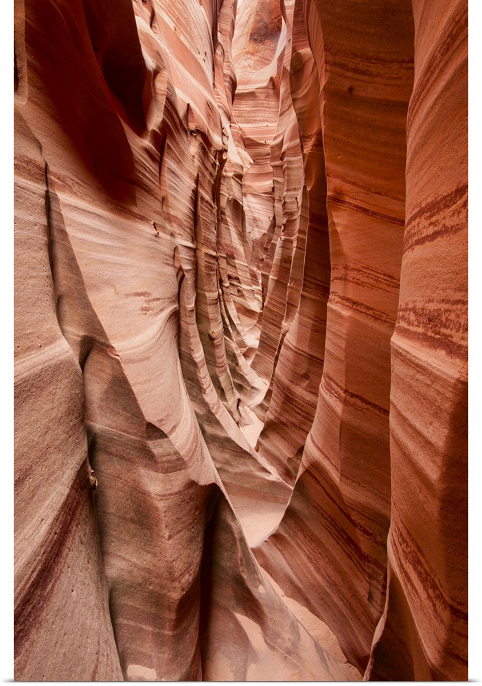 A photograph through a narrow corridor of a rocky canyon.