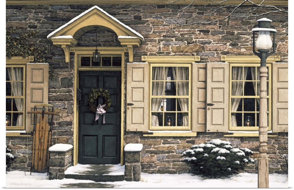 The front of a stone house with candles in the windows and a doorway with a wreath hanging on it.