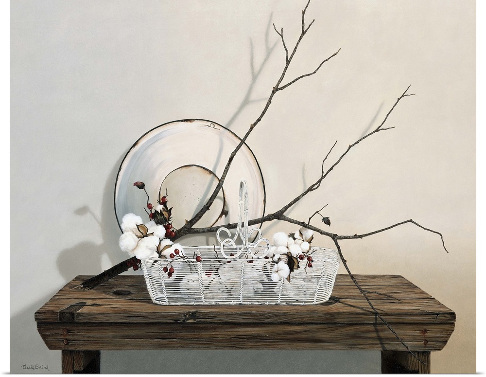 Wire basket on table with branch of cotton.