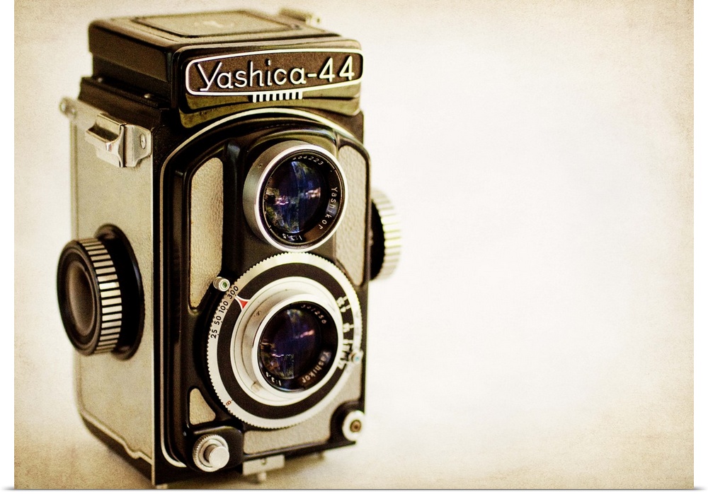 Photograph of a vintage camera with a vintage sepia look to it.
