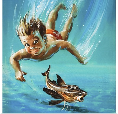 A young child diving as a tropical fish is startled