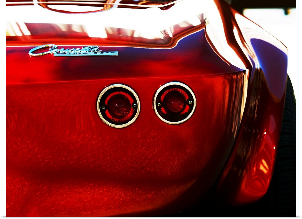Photograph of the rear and break lights of a red 1963 Corvette Stingray 15.