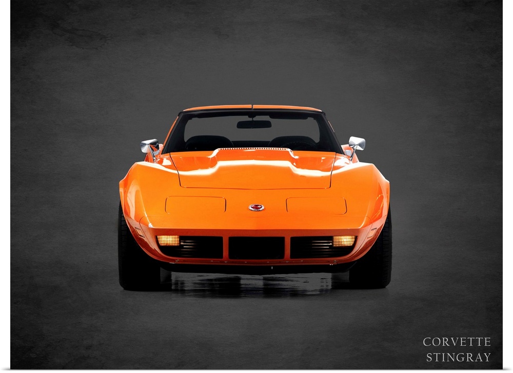 Photograph of an orange 1974 Chevrolet Corvette Stingray printed on a black background with a dark vignette.