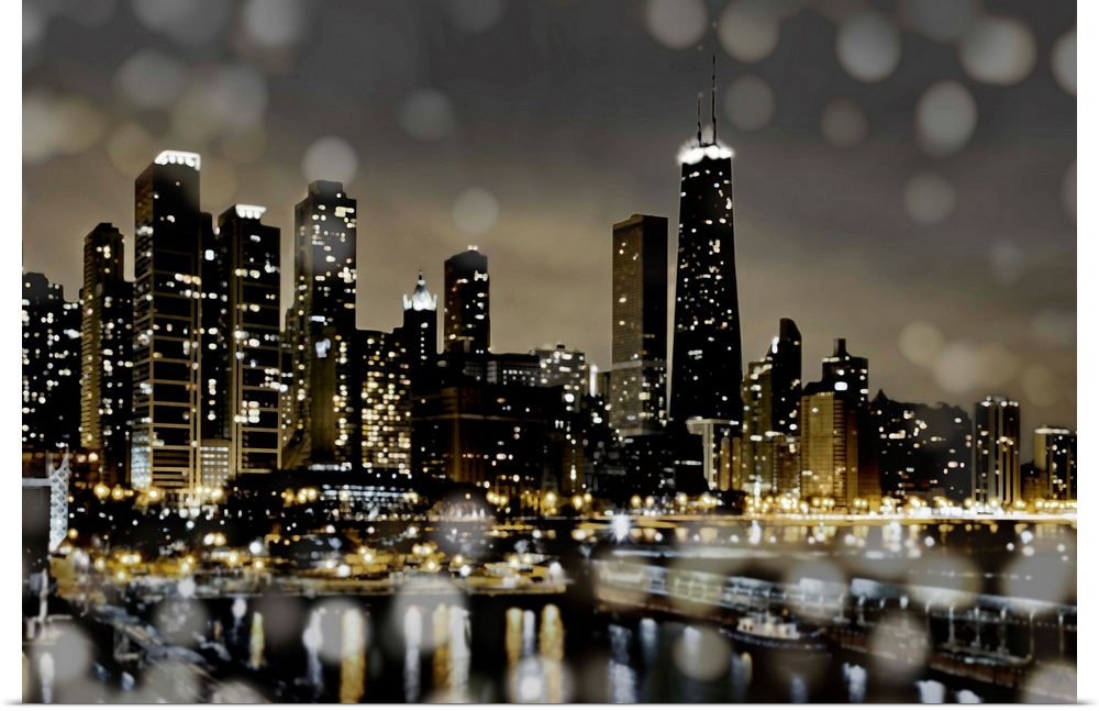 The Chicago skyline lit up at night with the harbor and bokeh lights in the foreground.