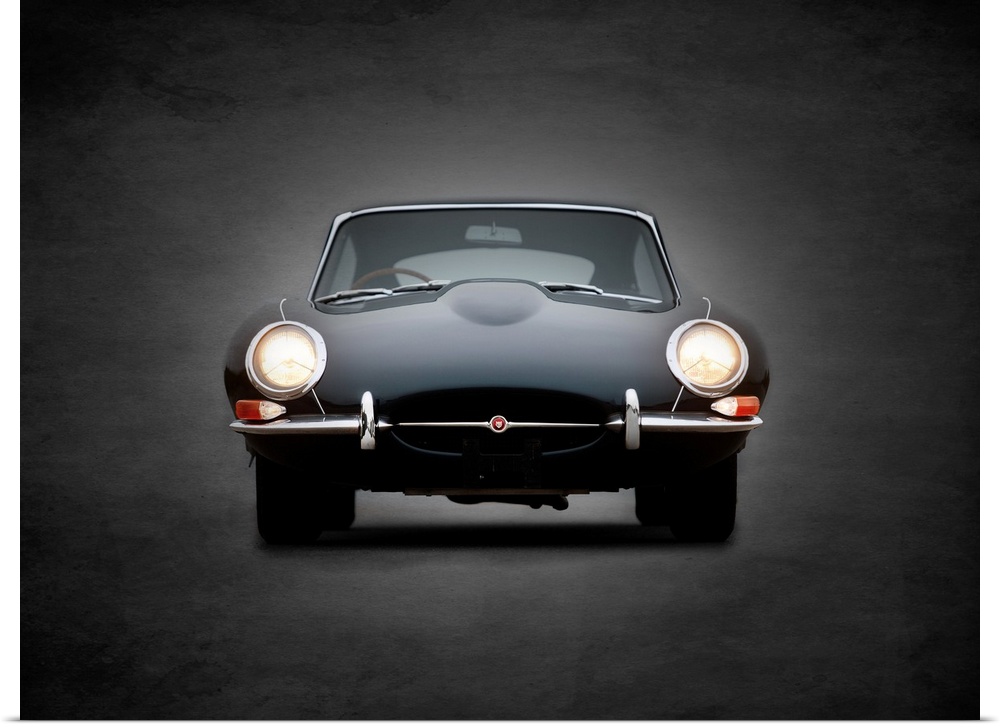 Photograph of a black E-Type printed on a black background with a dark vignette.