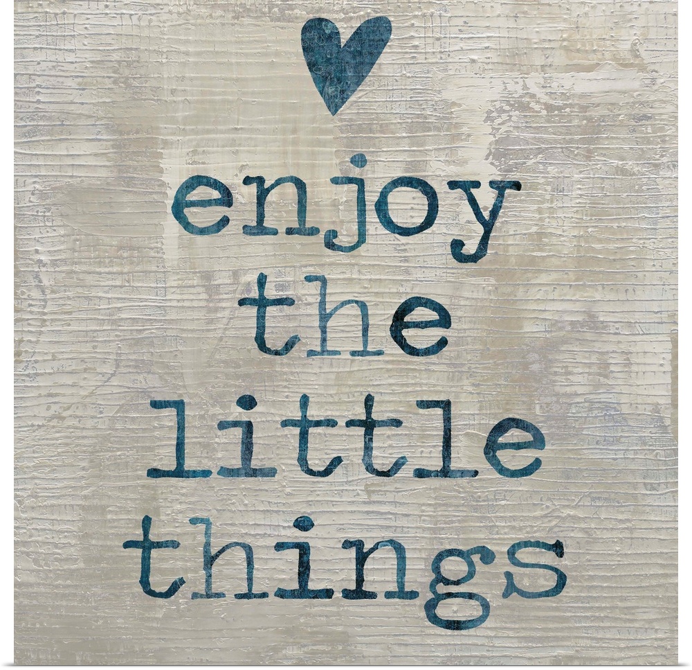"enjoy the little things" written in blue with a heart above, on a textured neutral colored background.