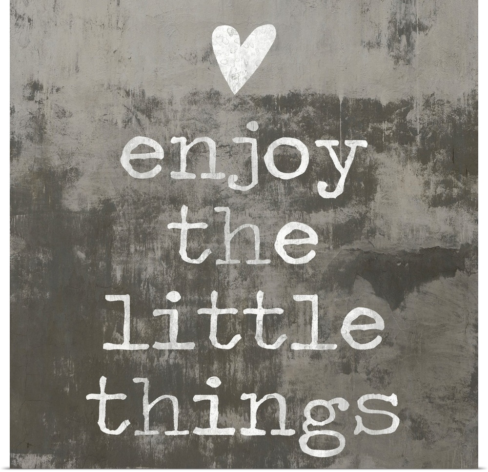 "enjoy the little things" written in white with a heart above, on a background made with dark and light gray hues.