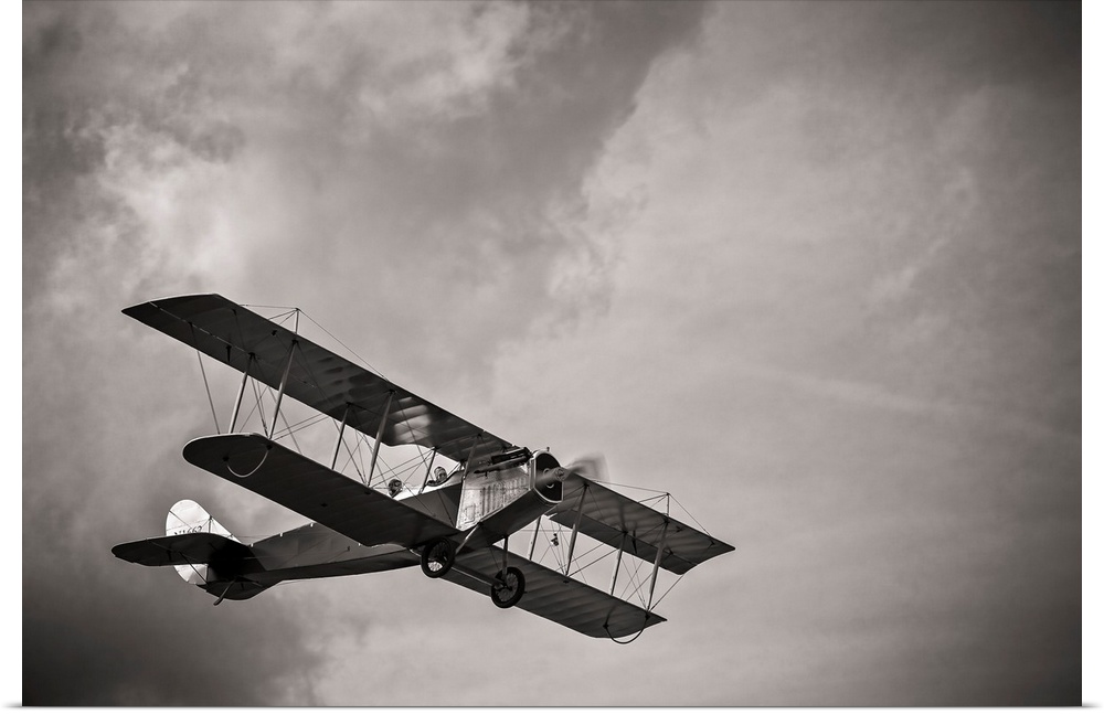 A fully restored Curtiss JN-4 "Jenny" flies over the grass strip at Peachstate Aerodrome in Williamson, Georgia.