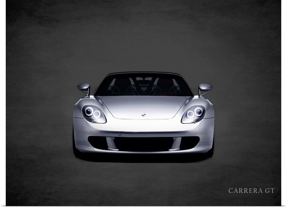 Photograph of a silver Porsche Carrera GT printed on a black background with a dark vignette.