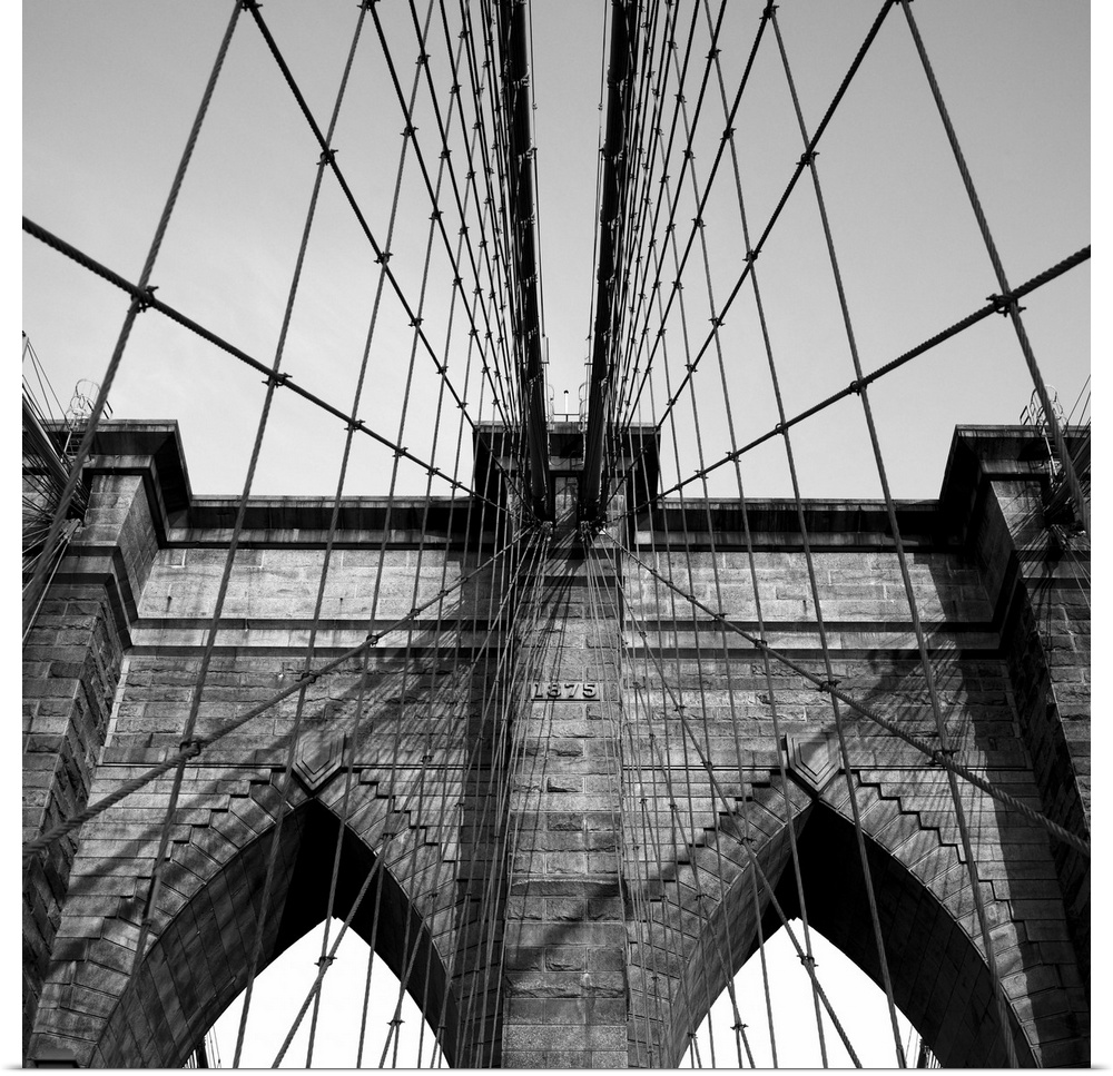 Black and white close up of the Brooklyn Bridge.