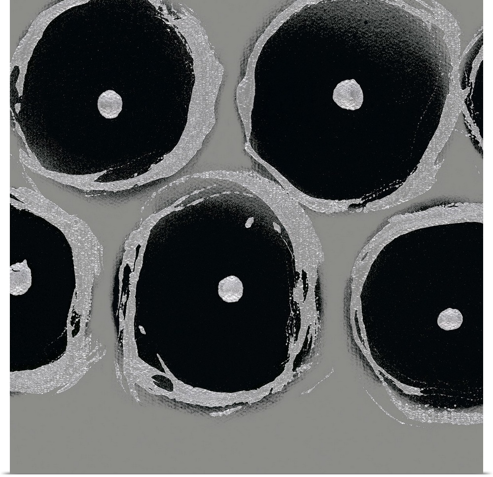 A square abstract of circular shapes with dots in the center in shades of light gray and black.
