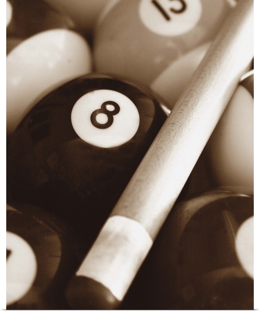 Sepia toned photo of a pool cue and pool balls.