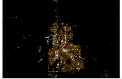 Calgary at night, shining in the foothills of the Rockies.