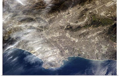 Los Angeles, CA. The grey of pavement and dense population is visible from Earth orbit