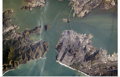 The Golden Gate Bridge from space, and if you look closely, its shadow