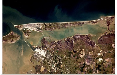 The long beach and silty waters of Galveston, Texas