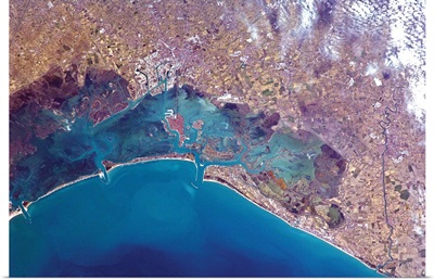 Venice's red roofs and white docks are visible from orbit - the Grand Canal too