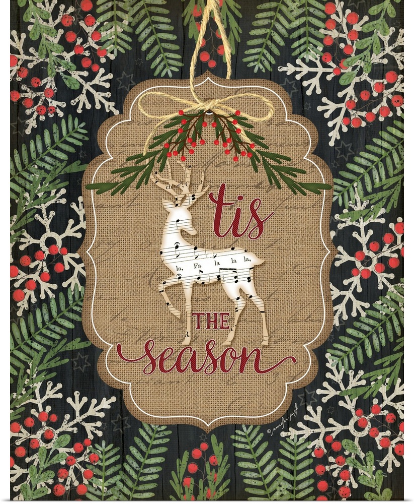Christmas decor featuring a deer cut out of sheets of music and the words, "'Tis the season" .