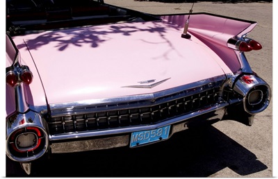 1959 pink Cadillac convertible on road in beautiful Varadero Beach in Valadero, Cuba