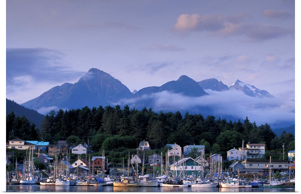 USA, Alaska, Sitka, part of the Sitka fishing fleet tied up, mountains of Baranof Island behind.