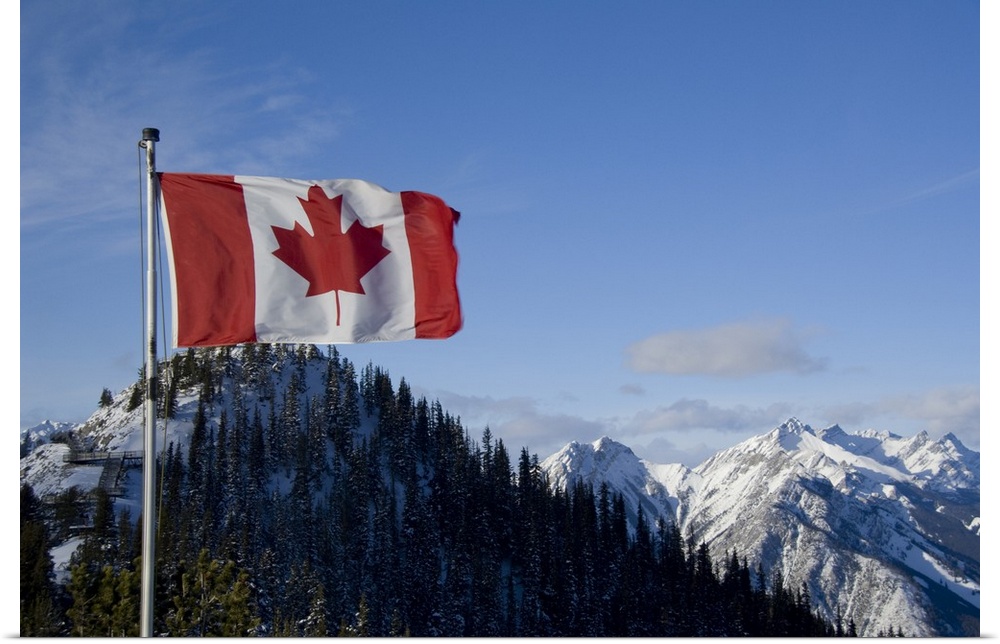 Canada, Alberta, Banff. Mountain views with Canadian flag on the summit of Sulphur Mountain.