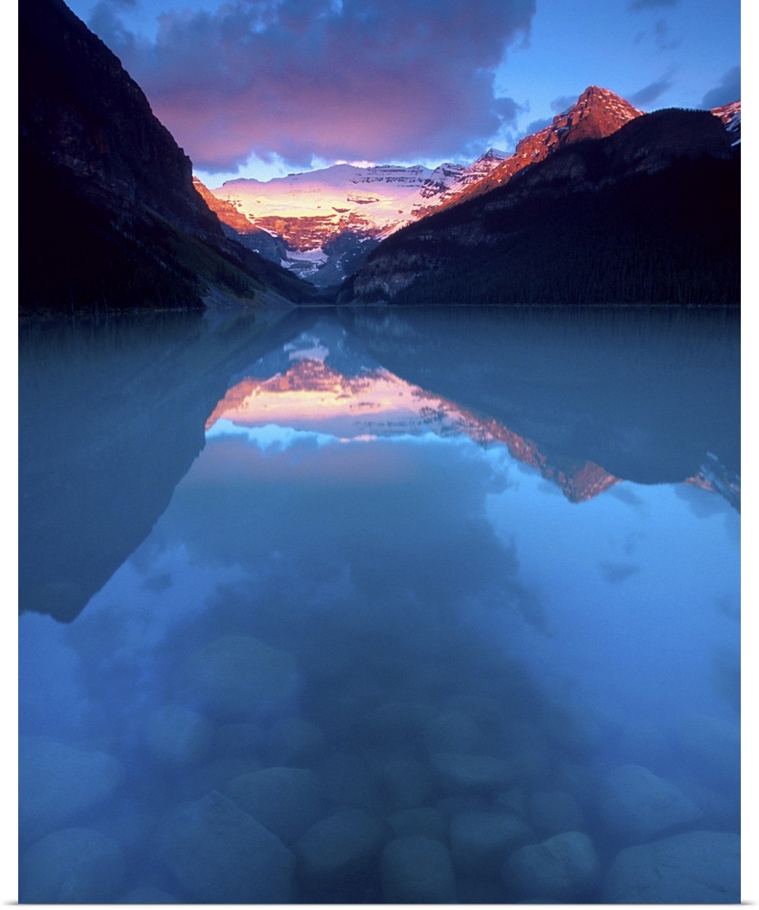 Canada, Alberta, Banff National Park. Sunrise reflects Victoria Glacier on Lake Louise. Credit as: David W. Kelley / Jayne...