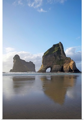 Archway Islands Reflected in Wet Sands of Wharariki Beach, South Island, New Zealand
