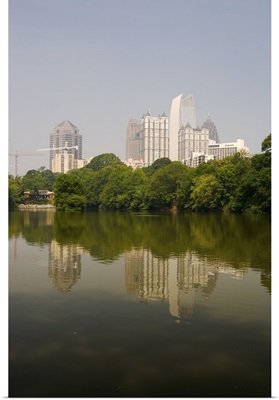 Atlanta skyline and its reflection seen in a pond at Piedmont Park