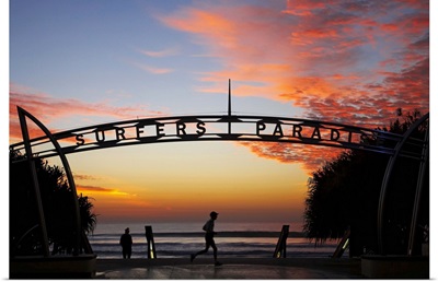 Australia, Queensland, Gold Coast, Jogger and Sign at Sunrise, Surfers Paradise
