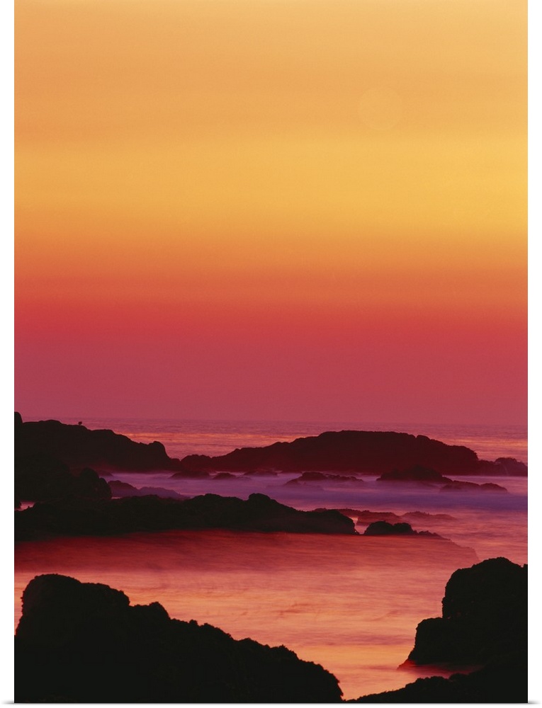 California, Monterey Peninsula, Pacific Grove, Offshore rocks at sunset