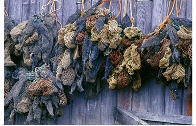 Canada, Nova Scotia, Hunts Point. Bait bags on fish shed wall