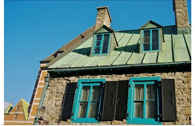 Canada, Quebec, Old Quebec City. A stone home's upper windows and copper roof