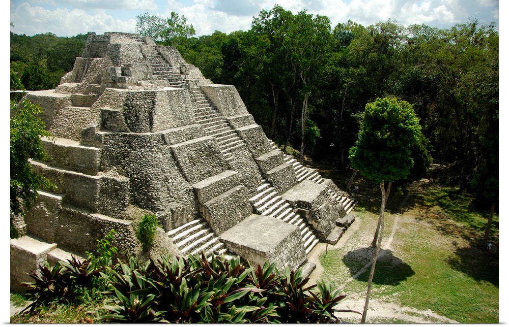 Central America, Guatemala, Yaxha. Classic Mayan pyramid surrounded by jungle.