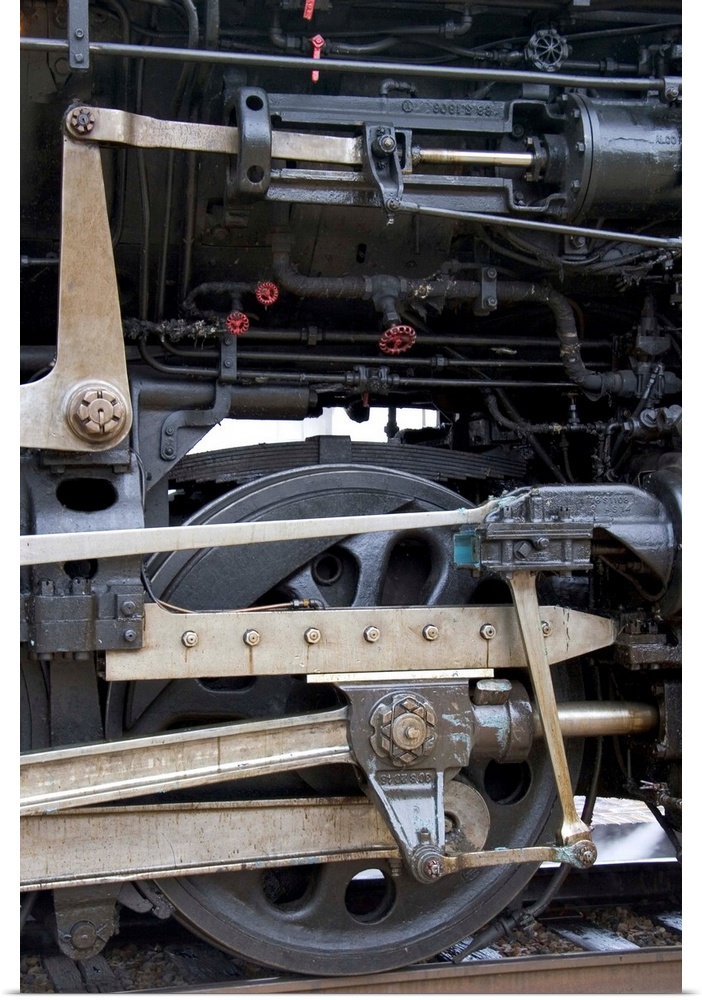 Close up detail view of a steam locomotive drive wheel...train, rail, railroad, engine, engineer, locomotive, transportati...