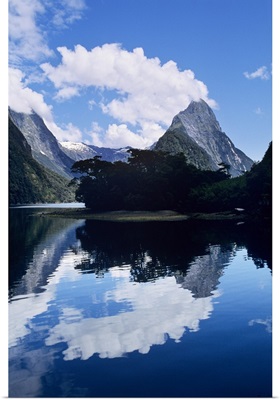 Cloud-capped Mitre Peak rises out of Milford Sound, South Island, New Zealand
