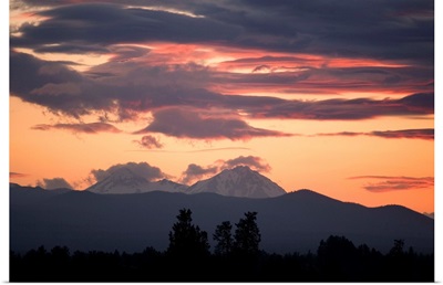 Clouds gather around the South and Middle Sisters at sunset, Bend, Oregon.
