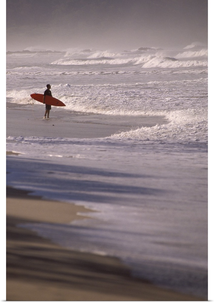 Costa Rica, Nicoya Peninsula. Surfer on Playa Santa Teresa.