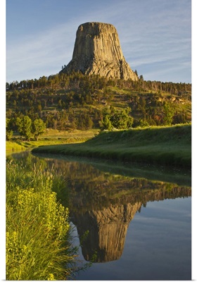 Devil's Tower National Monument, Wyoming, reflected in Belle Fourche River at sunrise