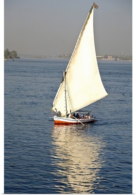 Egypt, Luxor. A felluca sailboat on the waters of the Nile