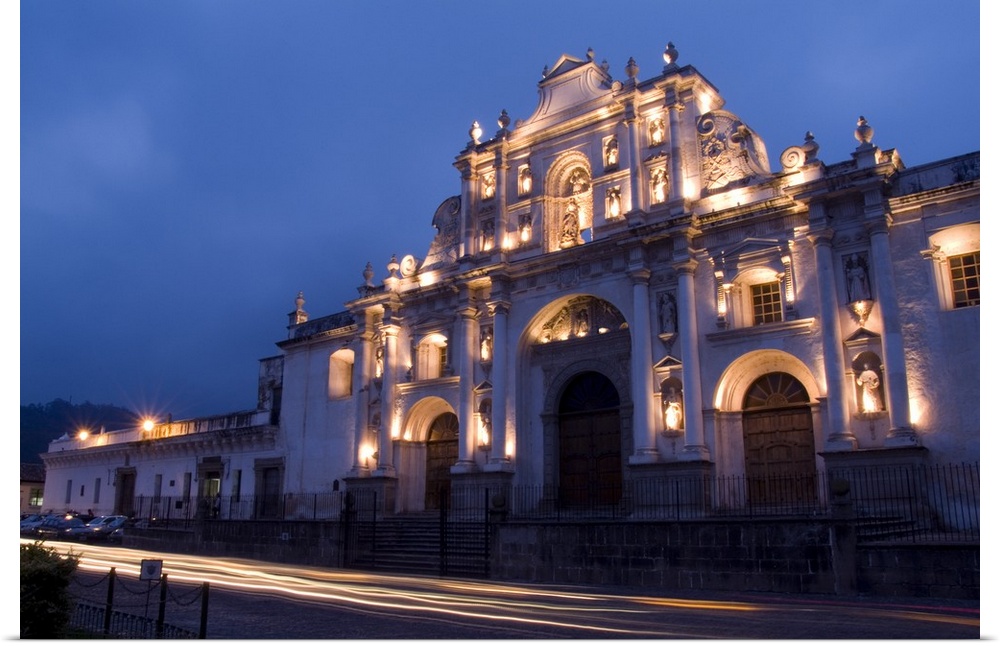 Night photo of famous Cathedral de Santiago with twilight and streaks of traffic in the tourism town of Antigua, Guatemala
