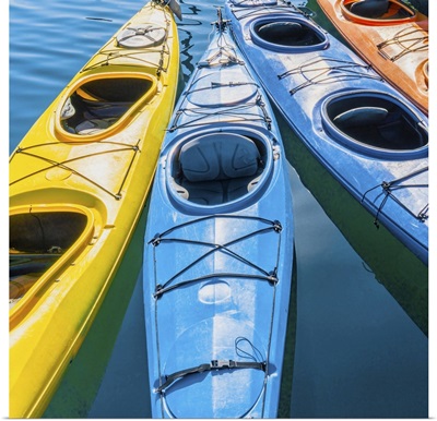 Four Colorful Kayaks Positioned In An Array