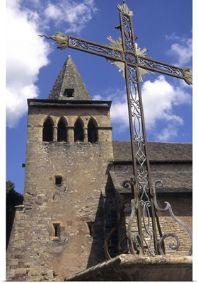 France, Averyon, Eglise Ste Fauste, steeple and bell tower behind iron cross