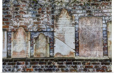 Georgia, Savannah, Tombstones on a wall in Historic Colonial Park Cemetery